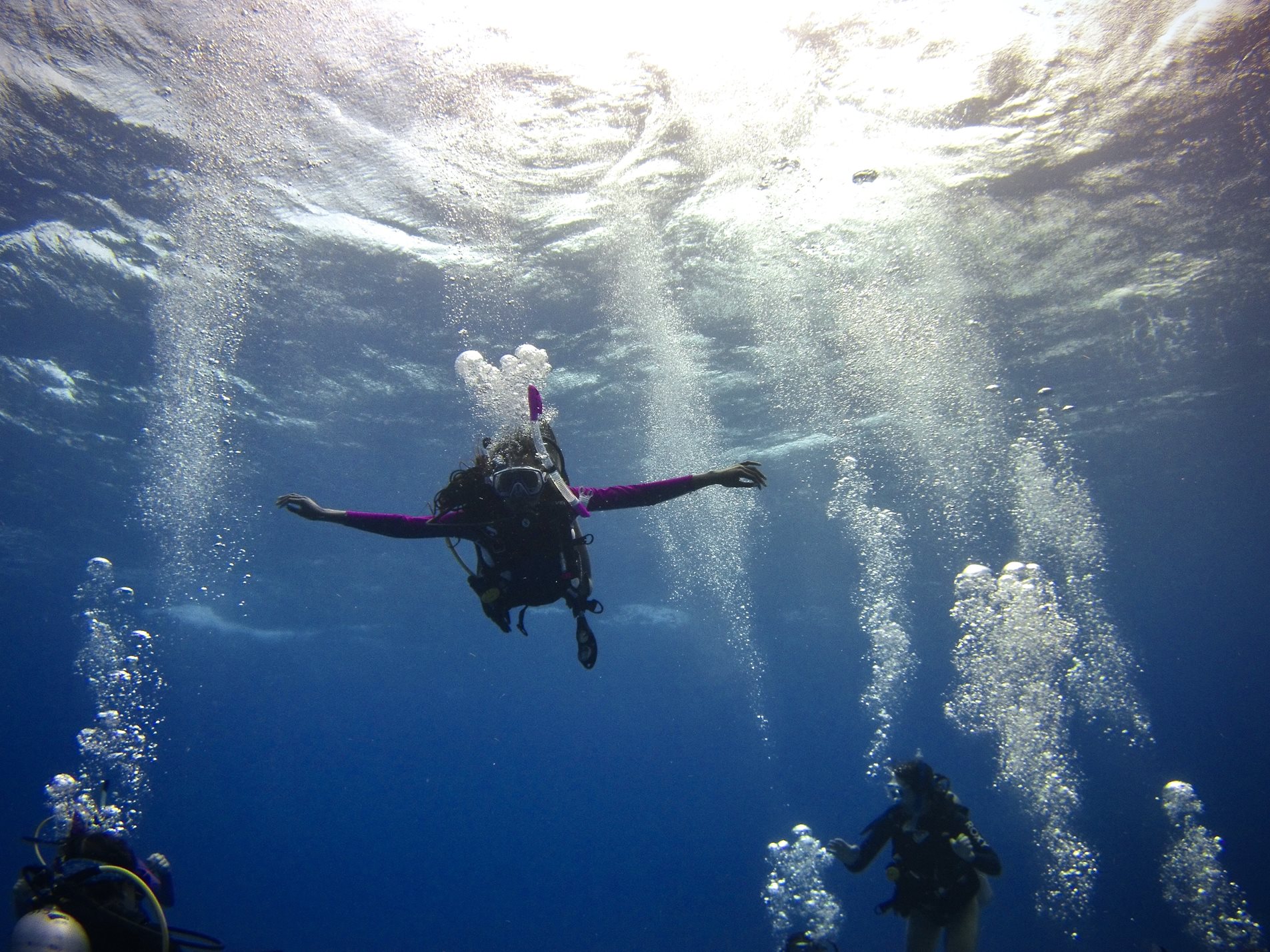 People scuba diving off the coast of Turks and Caicos Islands